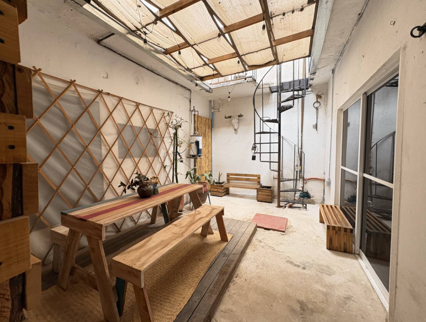 Shared courtyard patio at Casa del Colibrí with open-air light.